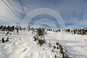VallNord, the ski lift chair El Cubil and the slope Cubil, the Principality of Andorra, the eastern Pyrenees, Europe. photo