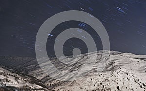 Valmeinier mountains at night stars in winter skiing area in the French Alps Savoie