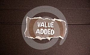 VALUE ADDE text on a clipboard on white background