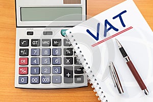 Value Added Tax VAT Finance Taxation Accounting Concept, VAT word handwritten on notebook