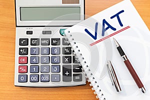 Value Added Tax VAT Finance Taxation Accounting Concept, VAT word handwritten on notebook photo