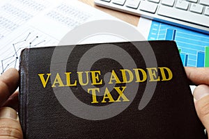 Value added tax VAT written on a book. photo