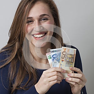 Value for money concept for laughing 20s Euro woman