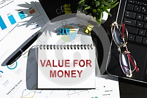 Value for Money - text on notepad on office table. Business and financial concept