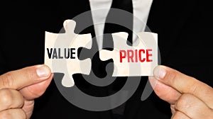 Value and price words written on two pieces of jigsaw puzzle