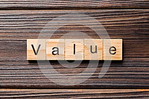 Value word written on wood block. value text on table, concept