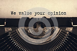 We value your opinion text typed on an old vintage typewriter in black and white