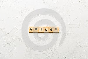 values word written on wood block. values text on table, concept