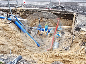 Valve and HDPE pipe welded underground. City water system photo