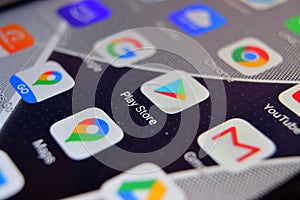 Close-up view of Google Play Store app on an Android smartphone, including other icons