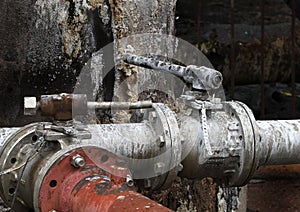 Valves and pipes in dirty environment. photo