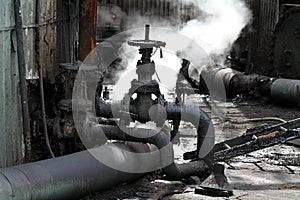 Valves and pipes in dirty environment. photo