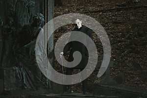 Vampire and cemetery statue