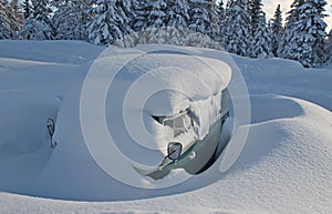 Van buried in snow