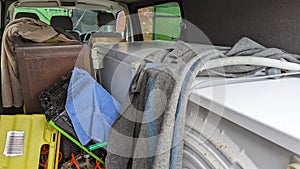 A van filled with house clearance household appliances ready to transport photo