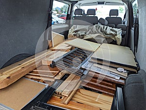 Van full of dismantled piled up house clearance furniture