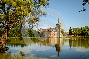 Van Horst Castle and its reflection in the lake, Belgium