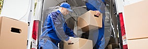 Van Movers Unloading Cardboard Boxes