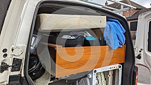 A van packed to the roof with household removal items photo