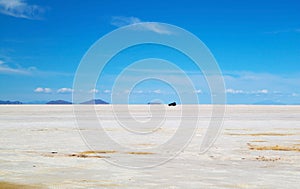 Van Parking on the Immense Salt Pan of Salar de Uyuni, Bolivia photo