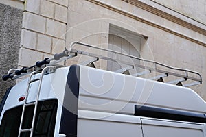 Van roof rack on top of a work small commercial vehicle truck