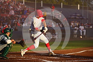 Batter starts his swing at an pitch