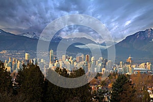 Vancouver BC City Skyline with Mountains photo