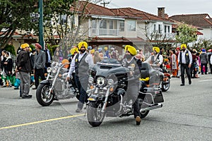 VANCOUVER, CANADA - April 14, 2018: people from sikh motorcycle club on the street during annual Indian Vaisakhi Parade