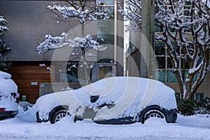 Vancouver, Canada - Circa 2021 : A Car buried in snow after Christmas snowfall