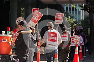 Striking hotel workers block sidewalk in downtown Vancouver