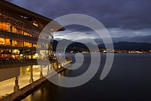 Vancouver harbour at night with convention centre and North Shore