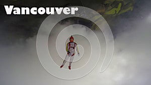 Vancouver. Skydiver from Vancouver performs a trick in the sky. Free fall.