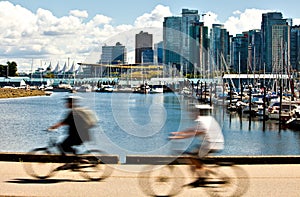 Two cyclists pedaling