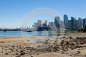 The Vancouver Skyline and Canada Place at low tide from Stanley Park in summer