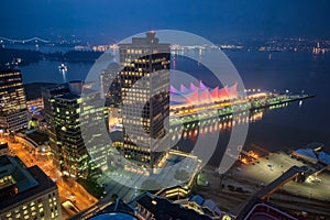 Vancouver skyline with Canada Place at night, aerial view
