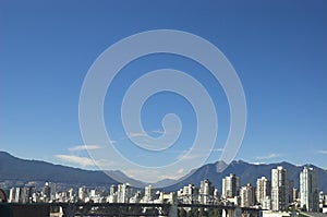 Vancouver skyline with Rocky Mountains photo