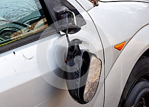 Vandalism on the exterior mirror of a car