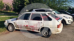 Vandalism - a modern car, doused with paint in free parking