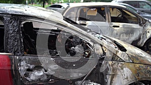 Vandalism or revenge, burnt car. The consequences of popular protest, burnt car, a crime. Car after fire. Auto trash