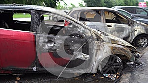 Vandalism or revenge, burnt car. The consequences of popular protest, burnt car, a crime. Car after fire. Auto trash