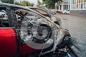 Vandalism or revenge, burnt car. The consequences of popular protest, burnt car, a crime. Car after fire. Auto trash