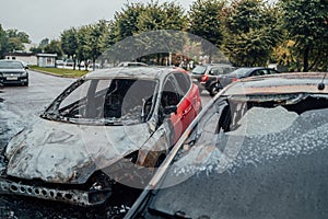 Vandalism or revenge, burnt car. The consequences of popular protest, burnt car, a crime. Car after fire. Auto trash