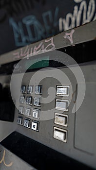 Vandalized and dirty public telephone