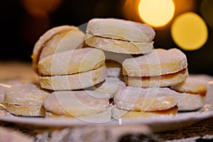 Vanilice, sandwich cookie with nice lights in the background served on a plate