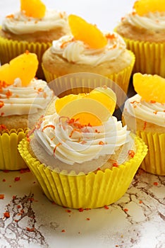 Vanilla buttercream cupcake with orange