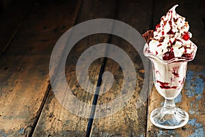 Vanilla, cherry and chocolate ice cream sundae