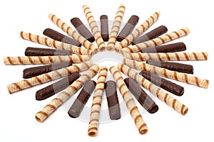 Vanilla and chocolate sticks with a cream, isolated