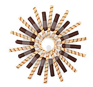 Vanilla and chocolate sticks with a cream, isolated