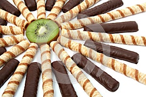Vanilla chocolate sticks with a cream and sliced kiwi