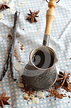 Vanilla coffee in the traditional cezve with a vanilla pod.